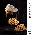 Viennese waffles and cream in the form of a cloud. chocolate rain 106387969