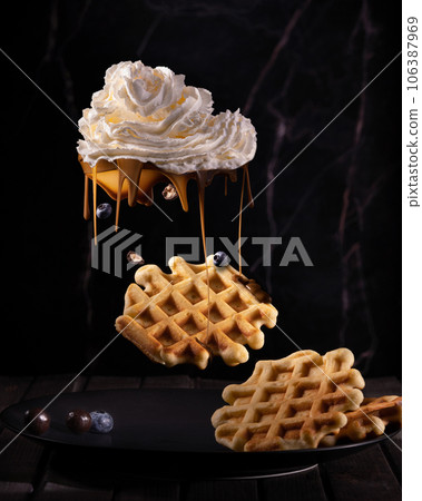 Viennese waffles and cream in the form of a cloud. chocolate rain Viennese waffles and cream in the form of a cloud. chocolate rain 106387969
