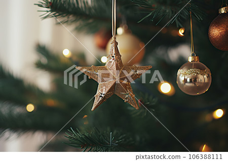 Close-Up of Modern Decorated Christmas Tree with Vintage Star, Baubles, and Golden Lights - Stylish Ornaments in Festive Room.. created with Generative AI Close-Up of Modern Decorated Christmas Tree with Vintage Star, Baubles, and Golden Lights - Stylish Ornaments in Festive Room.. created with Generative AI 106388111