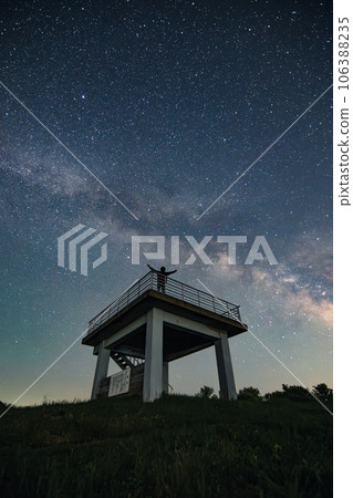 person looking up at the Milky Way 106388235