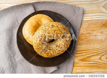 Bagel, Round Bread Bun, Wheat Bakery with Grains And Seeds for Breakfast, Plain Circle Bagel Bread Bagel, Round Bread Bun, Wheat Bakery with Grains And Seeds for Breakfast, Plain Circle Bagel Bread 106391508