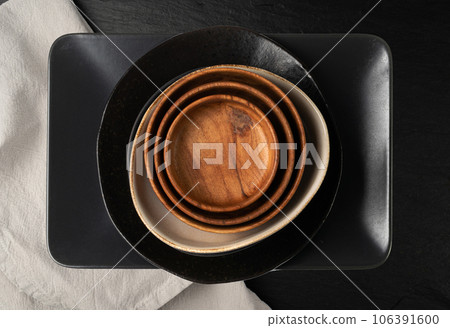Empty Wood Bowls and Plates Isolated, Wooden Bowl, Black Plate Mockup on White Background Top View, Empty Wood Bowls and Plates Isolated, Wooden Bowl, Black Plate Mockup on White Background Top View, 106391600