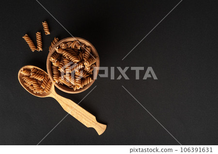 Raw Brown Pasta, Wholegrain Fusilli, Dry Whole Grain Noodle, Raw Spelt Macaroni, Healthy Italy Food 106391631