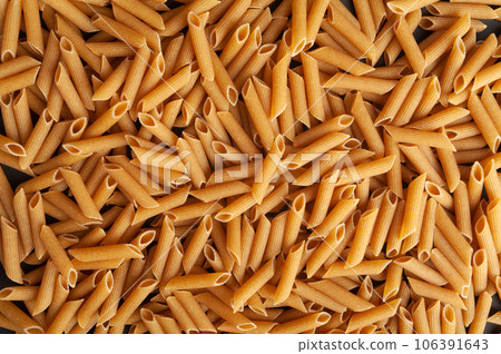 Raw Brown Pasta, Wholegrain Penne, Dry Whole Grain Noodle, Raw Spelt Macaroni, Healthy Italy Food Raw Brown Pasta, Wholegrain Penne, Dry Whole Grain Noodle, Raw Spelt Macaroni, Healthy Italy Food 106391643