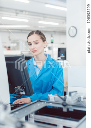 electrical engineer working in electronics manufacturing electrical engineer working in electronics manufacturing 106392299