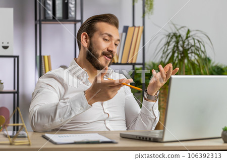 Businessman working on laptop at office talk on online communication video call with employee, boss Businessman working on laptop at office talk on online communication video call with employee, boss 106392313