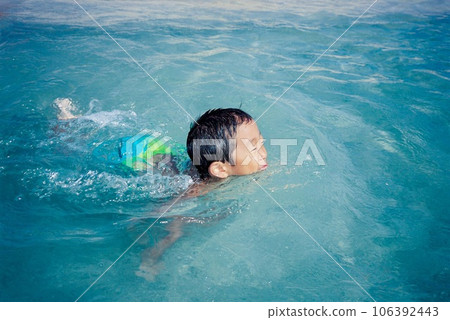 Sea bathing, a boy swimming smoothly in the beautiful sea Sea bathing, a boy swimming smoothly in the beautiful sea 106392443