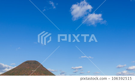 white clouds flowing over the mountain top 106392515