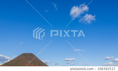 white clouds flowing over the mountain top white clouds flowing over the mountain top 106392517