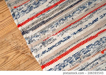 Rags Carpet Texture Background, Woven Rug Pattern, Handmade, Hand-Woven Rustic Carpet Made of Rags 106393543