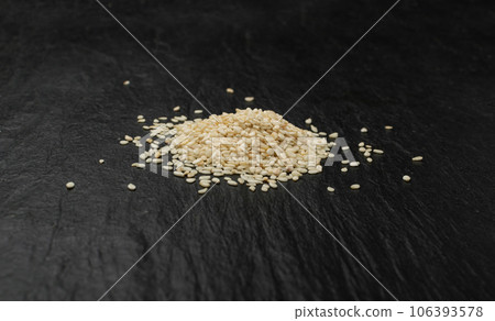 Sesame Seeds, White Sesamum Grains, Healthy Diet Garnish, Sesame Seeds on Black 106393578