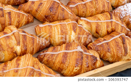 Many Croissant at Street Market, Fresh Puff Pastry Pies, Sweet Kipferls, Buttery Chocolate-Nutty Viennoiseries 106393747