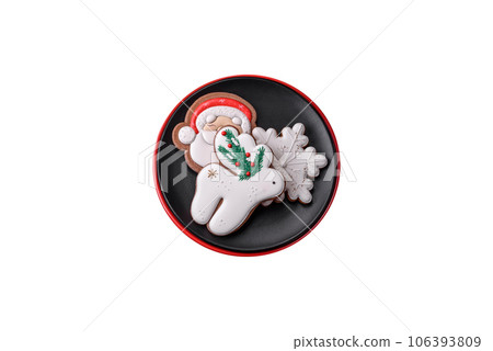 Beautiful bright colorful homemade gingerbread cookies on a ceramic plate 106393809