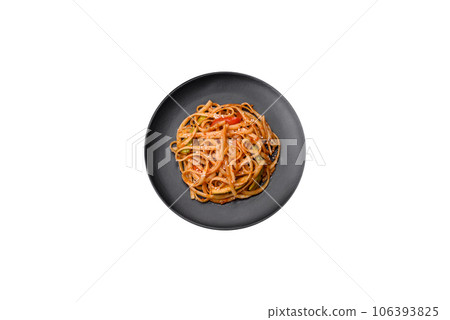 Delicious asian udon dish with vegetables, mushrooms, salt and spices Delicious asian udon dish with vegetables, mushrooms, salt and spices 106393825