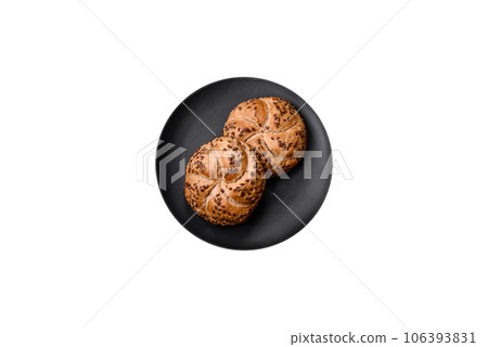 Delicious freshly baked crispy bun or kaiser roll with sesame seeds 106393831