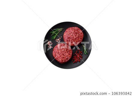 Fresh raw ground beef burger patty with salt and spices Fresh raw ground beef burger patty with salt and spices 106393842