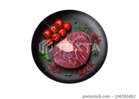 Fresh beef ossobuco steak with salt, spices and herbs Fresh beef ossobuco steak with salt, spices and herbs 106393862