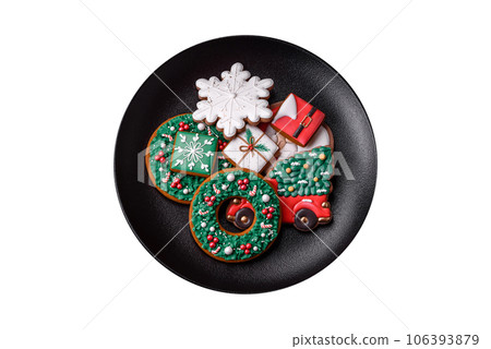 Delicious fresh colorful Christmas or New Year gingerbread cookies 106393879