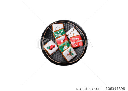 Delicious fresh sweet Christmas gingerbread with festive ornaments Delicious fresh sweet Christmas gingerbread with festive ornaments 106393898