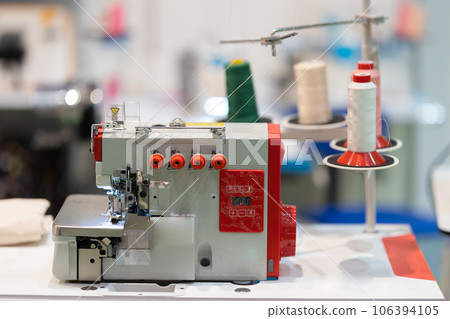 Spools of threads are connected to an embroidery machine 106394105