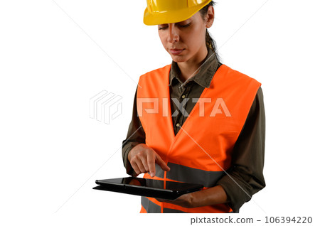 woman with helmet who work in a warehouse 106394220