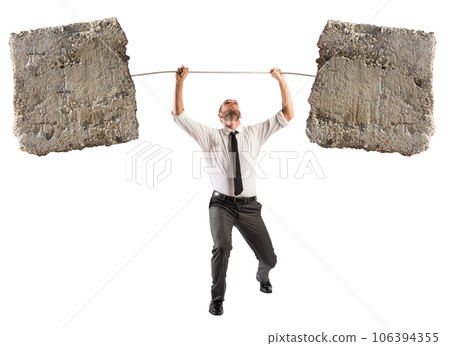 Powerful and determined  businessman trains with a barbell with stones 106394355