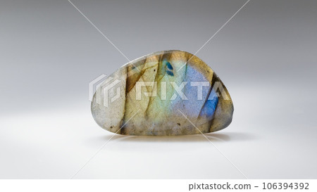 Polished Labradorite Mineral Gem Stone on Grey Polished Labradorite Mineral Gem Stone on Grey 106394392