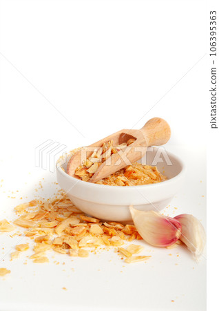 Dry Garlic Slices, Crispy Fried Cloves Pile Closeup, Roasted Grilled Garlic Flakes, Clove Chip Group 106395363