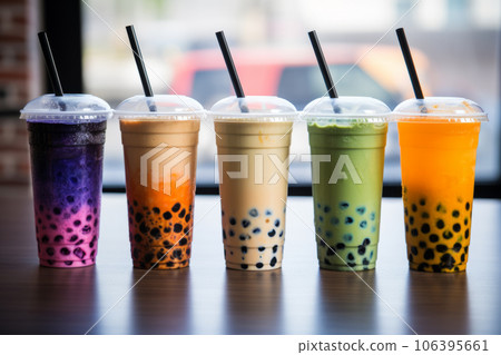 Row of fresh boba bubble tea glasses on a table 106395661