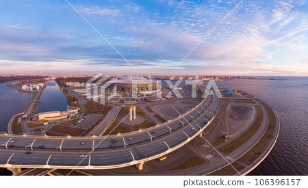 08 may 2019, St. PETERSBURG Russia: Aerial view of Football stadium Zenit Arena at sunset and new road - Western High Speed Diameter connecting Krestovsky and Vasilyevsky Islands. Viaduct above Neva 08 may 2019, St. PETERSBURG Russia: Aerial view of Football stadium Zenit Arena at sunset and new road - Western High Speed Diameter connecting Krestovsky and Vasilyevsky Islands. Viaduct above Neva 106396157