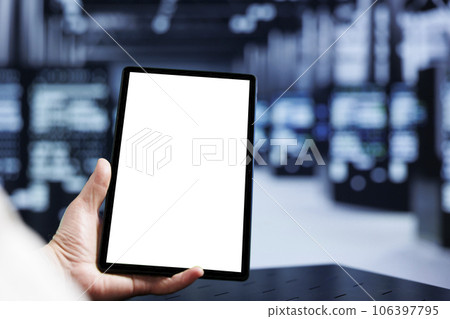 Admin using mock up tablet in supercomputer hub, installing dedicated VPN servers able to provide encrypted sensitive data, online anonymity and fast speed bandwidth to customers, close up Admin using mock up tablet in supercomputer hub, installing dedicated VPN servers able to provide encrypted sensitive data, online anonymity and fast speed bandwidth to customers, close up 106397795