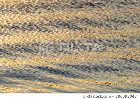 The surface of the lake sparkling in the morning sun The surface of the lake sparkling in the morning sun 106398048