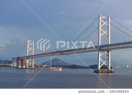 Seto Ohashi Bridge viewed from the ocean (towards Iinoyama, Utazu, Marugame Castle, and Gold Tower) 106398843