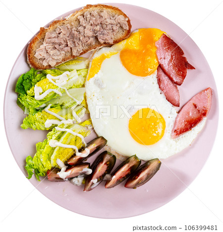 Serving plate with scrambled eggs, ham, tomatoes, brussels sprouts and tuna sandwich 106399481