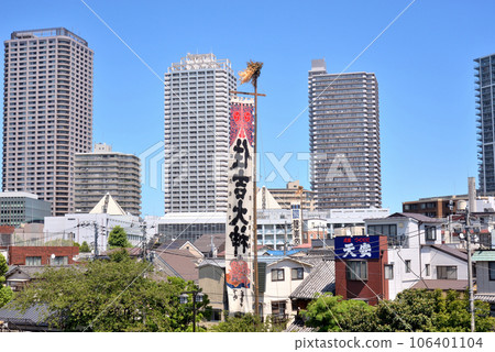 High-rise apartment complex visible beyond the Sumiyoshi Shrine annual festival 106401104