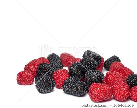 Marmalade in the form of berries on a white background. Blackberry and raspberry. Sweets in the form of blackberries and raspberries. Tasty food. 106401169
