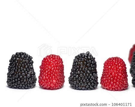 red and black gummies in the form of berries. Sweets in the form of raspberries and blackberries on a white background. Marmalade isolate. 106401171