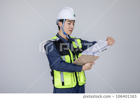 millennials and gen z, korean asian young man, site staff checking a document 106401383