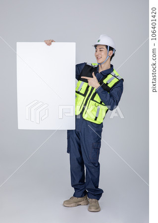 millennials and gen z, korean asian young man, site staff pointing a frame panel 106401420