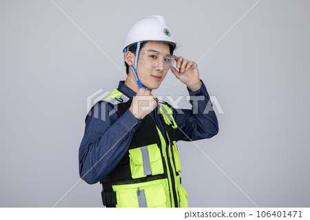 millennials and gen z, korean asian young man, site staff wearing protective goggles with hand motion 106401471
