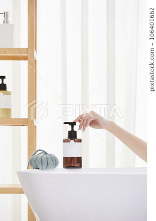 beauty concept photo of korean asain beautiful woman applying shower gel onto a shower pouf. beauty concept photo of korean asain beautiful woman applying shower gel onto a shower pouf. 106401662