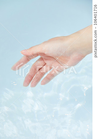 beauty concept photo of korean asain beautiful woman's hand mixing sea salt in a bathtub 106401716