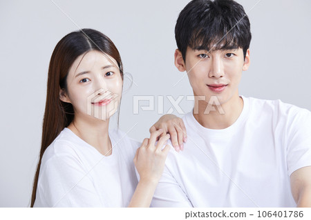 korean asian young couple sitting with hands on shoulders korean asian young couple sitting with hands on shoulders 106401786
