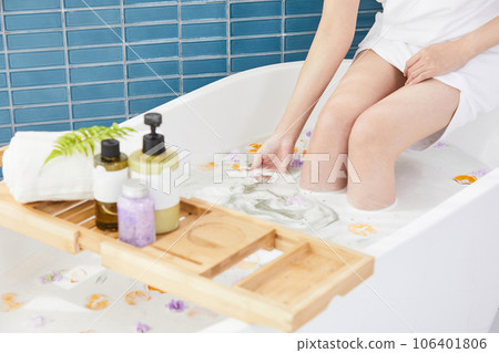 beauty concept photo of korean asain beautiful woman sitting in a bathtub with a bowl of fruit chips and flowers beauty concept photo of korean asain beautiful woman sitting in a bathtub with a bowl of fruit chips and flowers 106401806