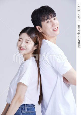 korean asian young couple standing back to back korean asian young couple standing back to back 106401838