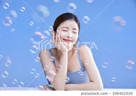 beauty concept photo of korean asain beautiful woman with soap bubbles 106402026