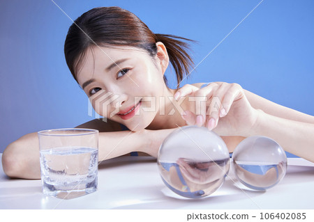 beauty concept photo of korean asain beautiful woman touching a crystal and smiling beauty concept photo of korean asain beautiful woman touching a crystal and smiling 106402085