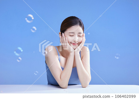 beauty concept photo of korean asain beautiful woman with soap bubbles 106402099