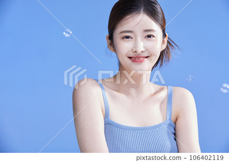 beauty concept photo of korean asain beautiful woman smiling with soap bubbles 106402119