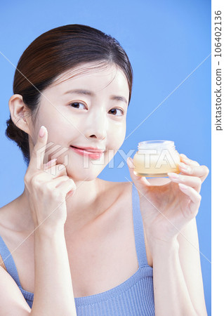 beauty concept photo of korean asain beautiful woman with a creem, cosmetics 106402136